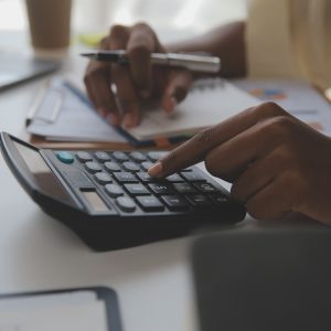 Asian Businesswoman Using laptop computer and working at office with calculator document on desk, doing planning analyzing the financial report, business plan investment, finance analysis concept. Mass Image Compressor Compressed this image. https://sourceforge.net/projects/icompress/ with Quality:80